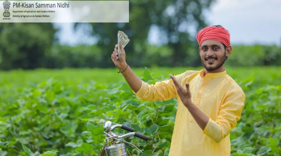 Happy farmer showing PM Kisan Samman Nidhi payment in field