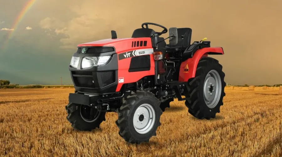 VST 932 DI tractor in a golden wheat field with rainbow in the background