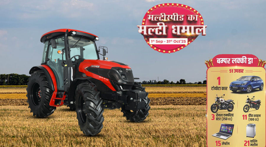 Red Solis tractor in harvested field with festive sales promo banner.